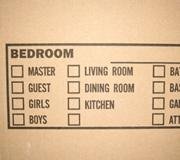 In addition to labeling what's in your boxes, add what room they'll be going into, as well.
